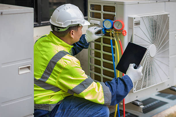 Professional Heat Pump Repair technician working in Mallard, IA